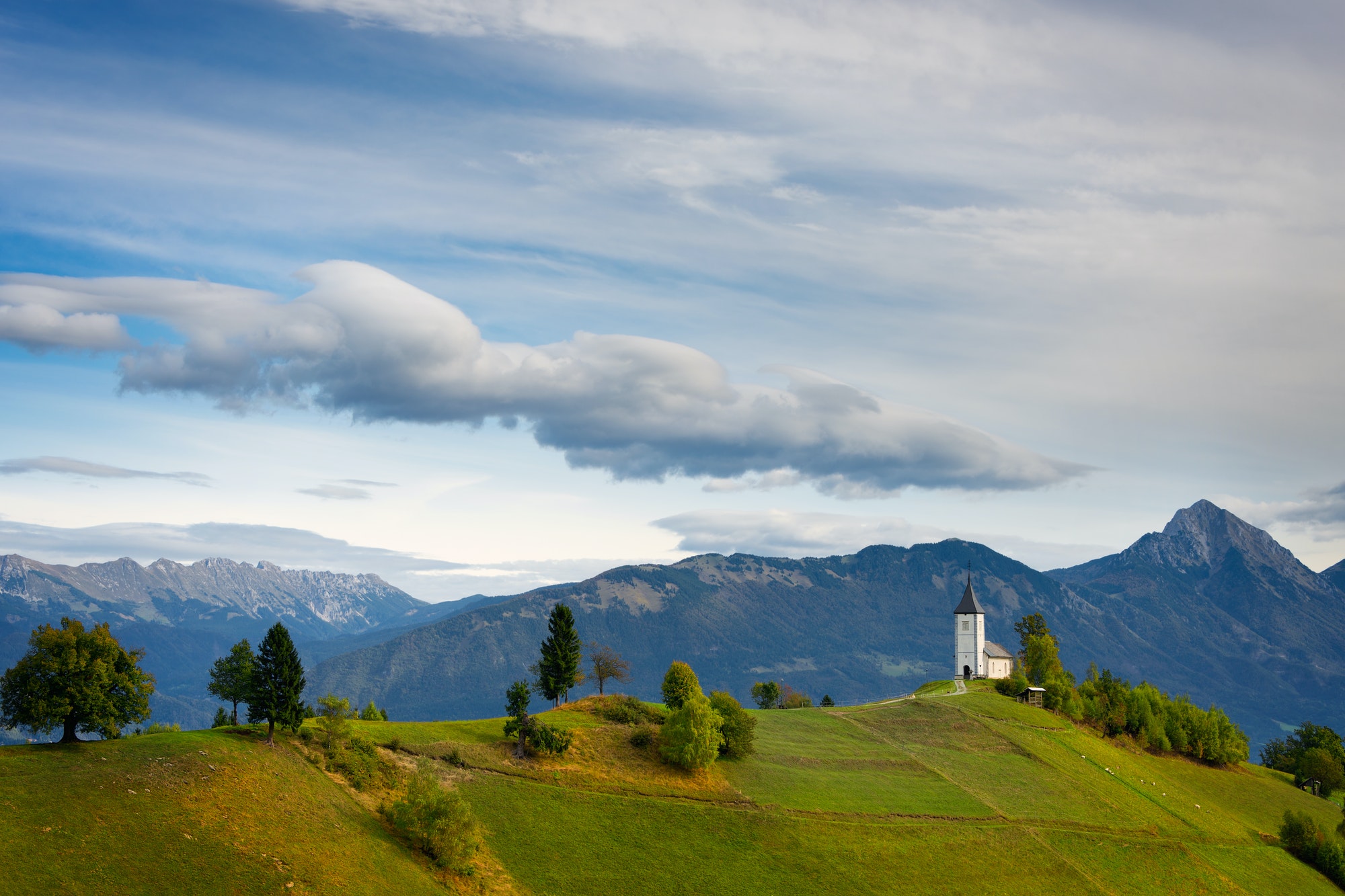 Jamnik church and Alps mountains in Slovenia